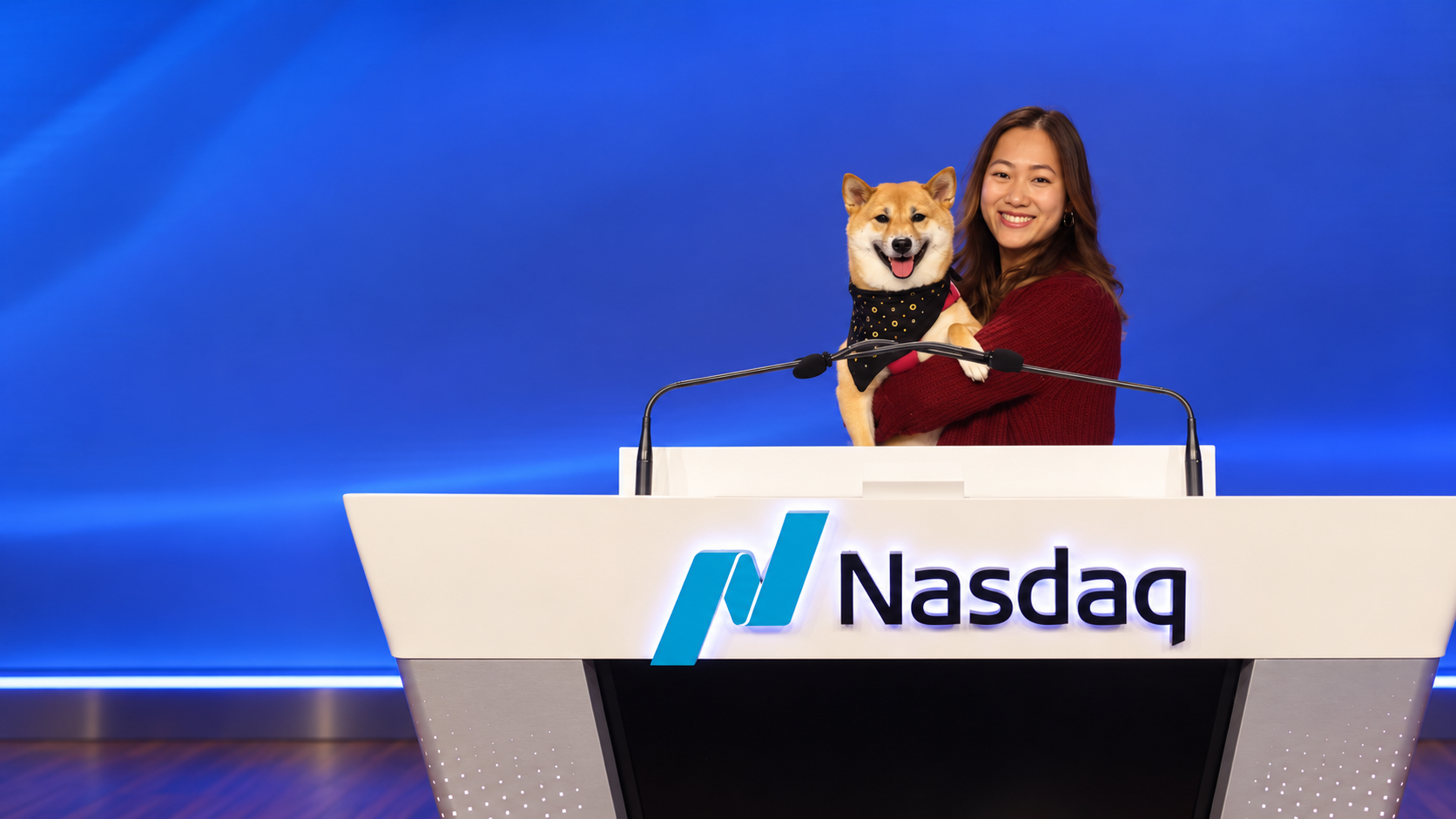 Kimchi and her owner at the Nasdaq podium